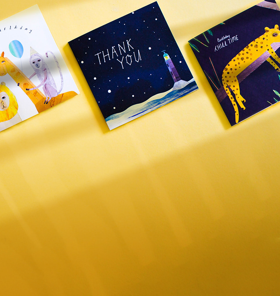 A collection of greetings cards all featuring different designs on a yellow background mobile crop