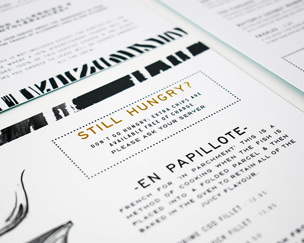 A closeup of the high-quality print detail of a flat menu.