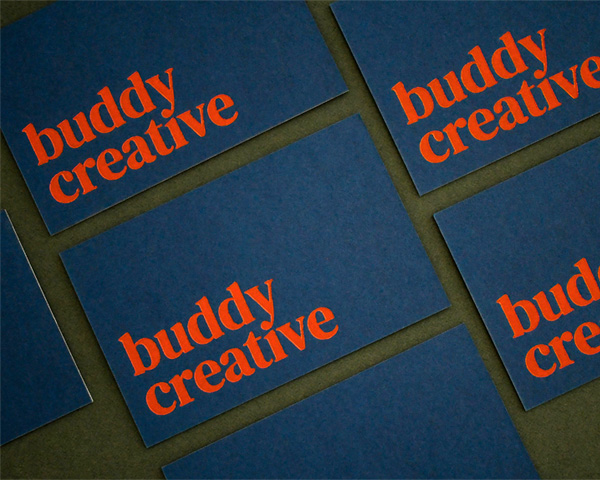 A collection of business cards for Buddy Creative.